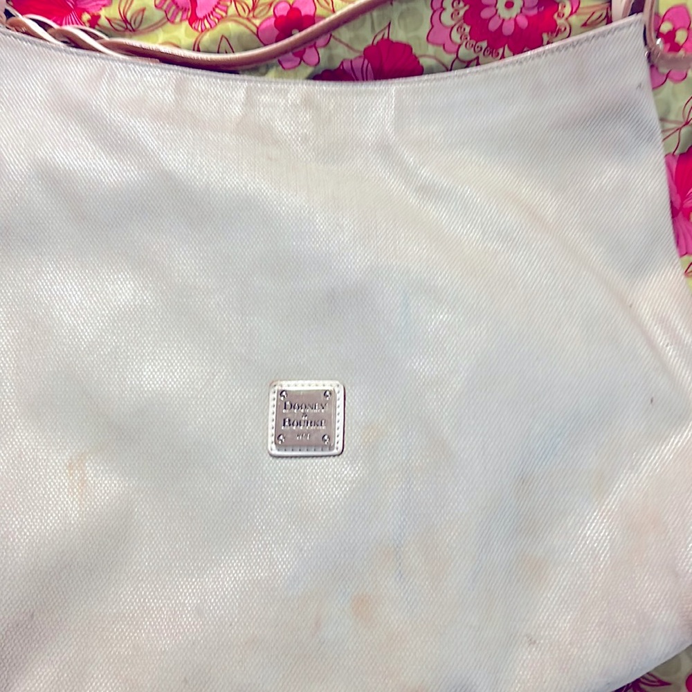 This is an Authentic Dooney and Bourke with all the life.